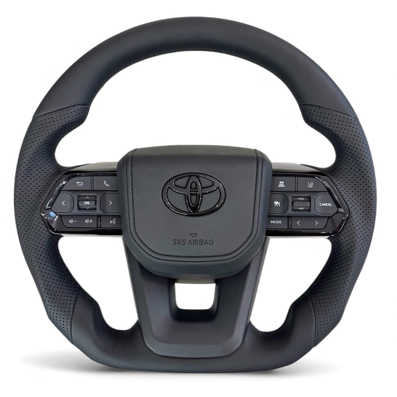 Руль для Toyota Sequoia в сборе кожа со скошенным низом логотип черный глянец (29371344)