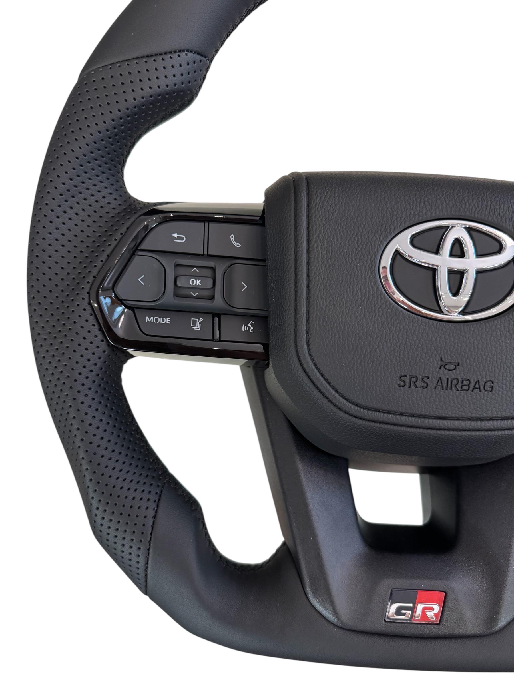 Руль для Toyota Land Cruiser 100 Prado 120 GR кожа со скошенным низом логотип хром (29342665) - фото 2 Руль для Toyota Land Cruiser 100 Prado 120 GR кожа со скошенным низом логотип хром (29342665) - фото 2