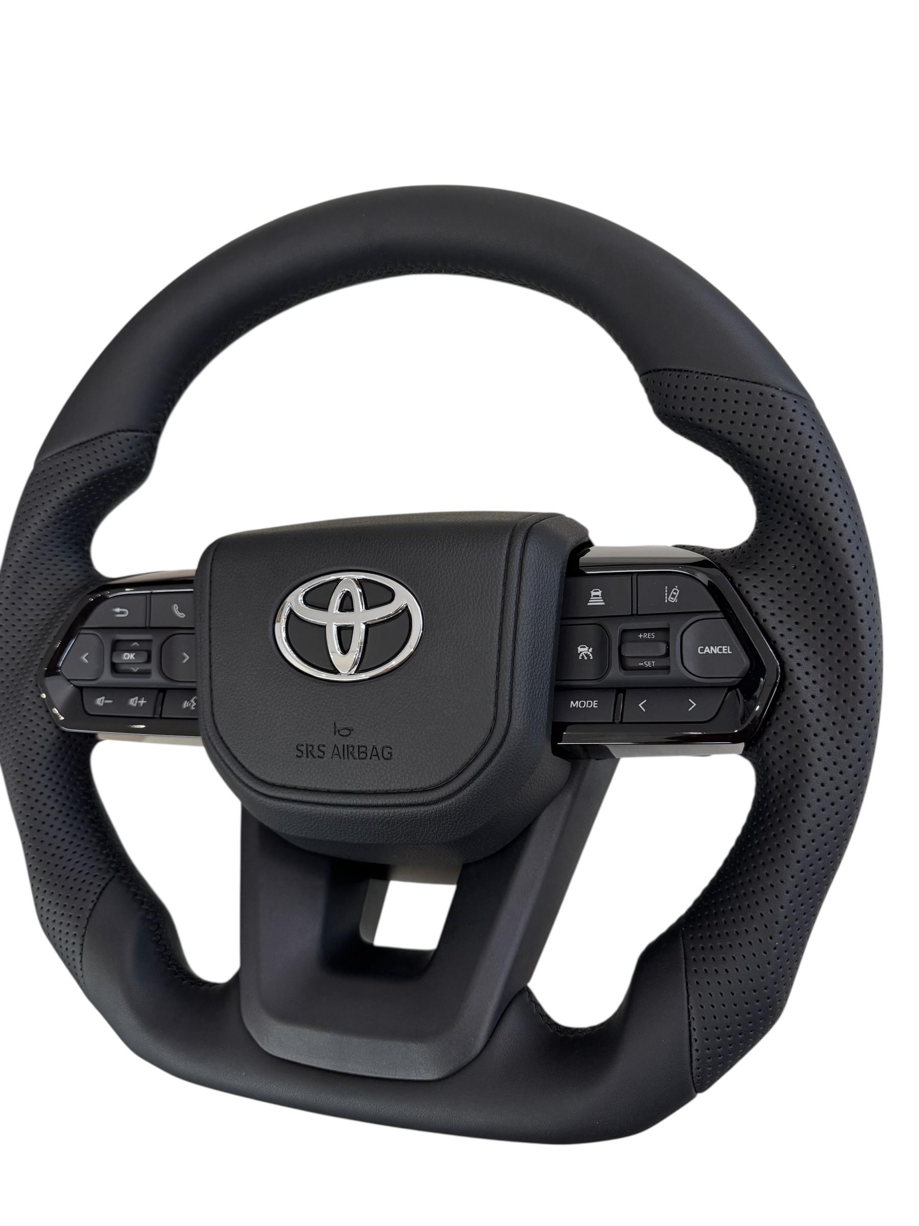 Руль для Toyota Land Cruiser 200 Prado 150 Без подогрева кожа со скошенным низом логотип хром (29342176) - фото 5 Руль для Toyota Land Cruiser 200 Prado 150 Без подогрева кожа со скошенным низом логотип хром (29342176) - фото 5