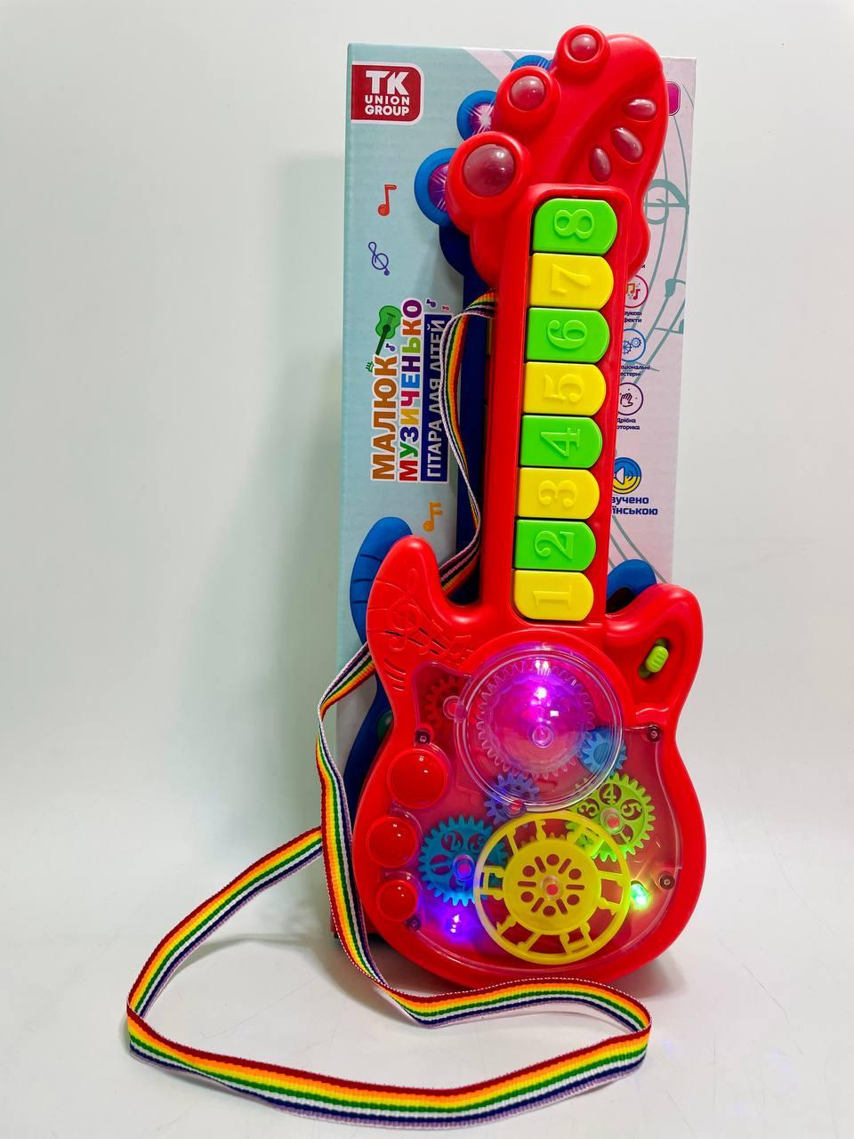 Гитара на батарейках TK Group 2 режима игры/8 песен/пианино/прозрачный корпус/подвижные шестерни Красный - фото 2 Гитара на батарейках TK Group 2 режима игры/8 песен/пианино/прозрачный корпус/подвижные шестерни Красный - фото 2