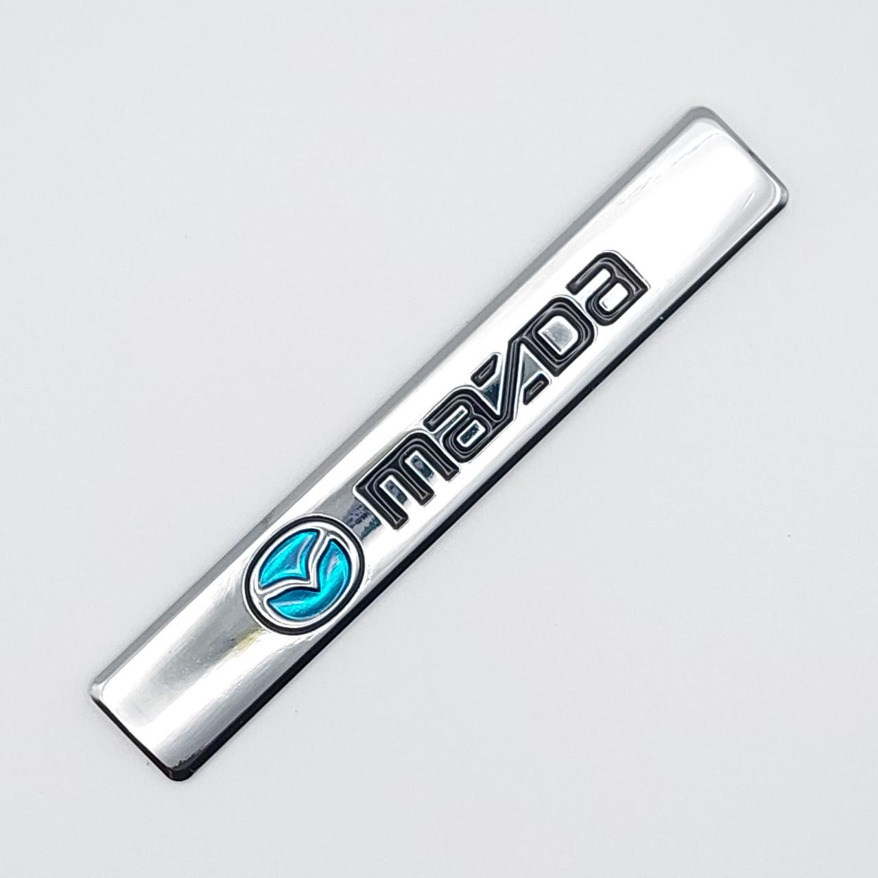 Эмблема плашка Mazda 9,2х1,2 см Хром глянцевый (1756791952)