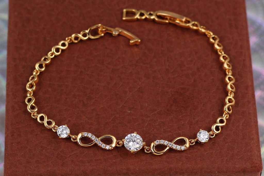 Браслет Xuping Jewelry Вісімки з каменями по центру 21 см x 7 мм Золотистий