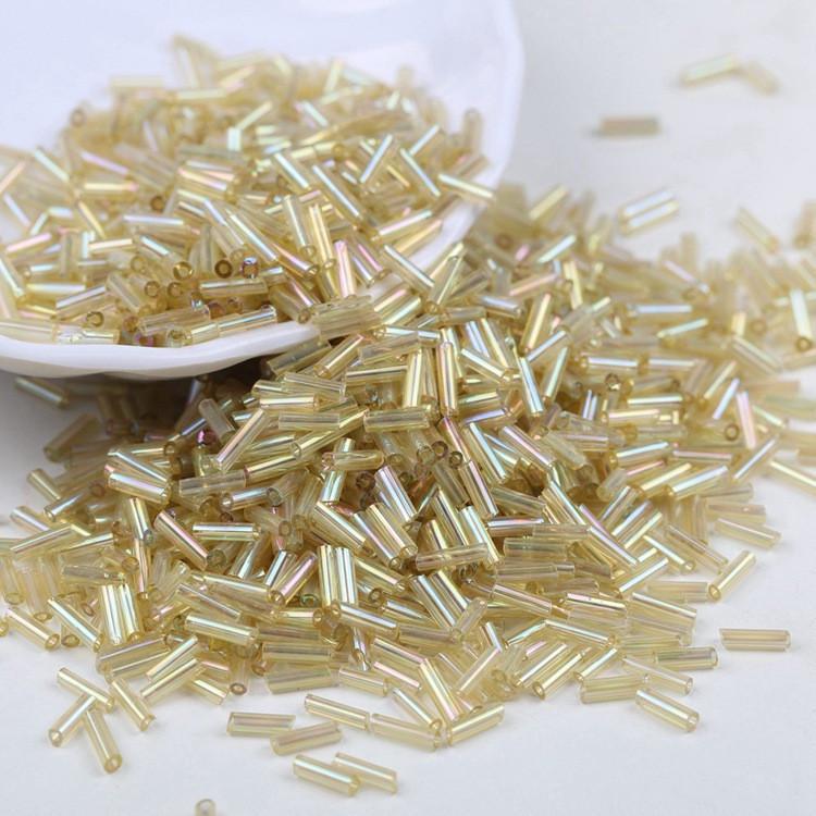 Бисер стеклярус блестящий 2х6 мм 50 г Золотистый светлый радужный (БР0206с84)