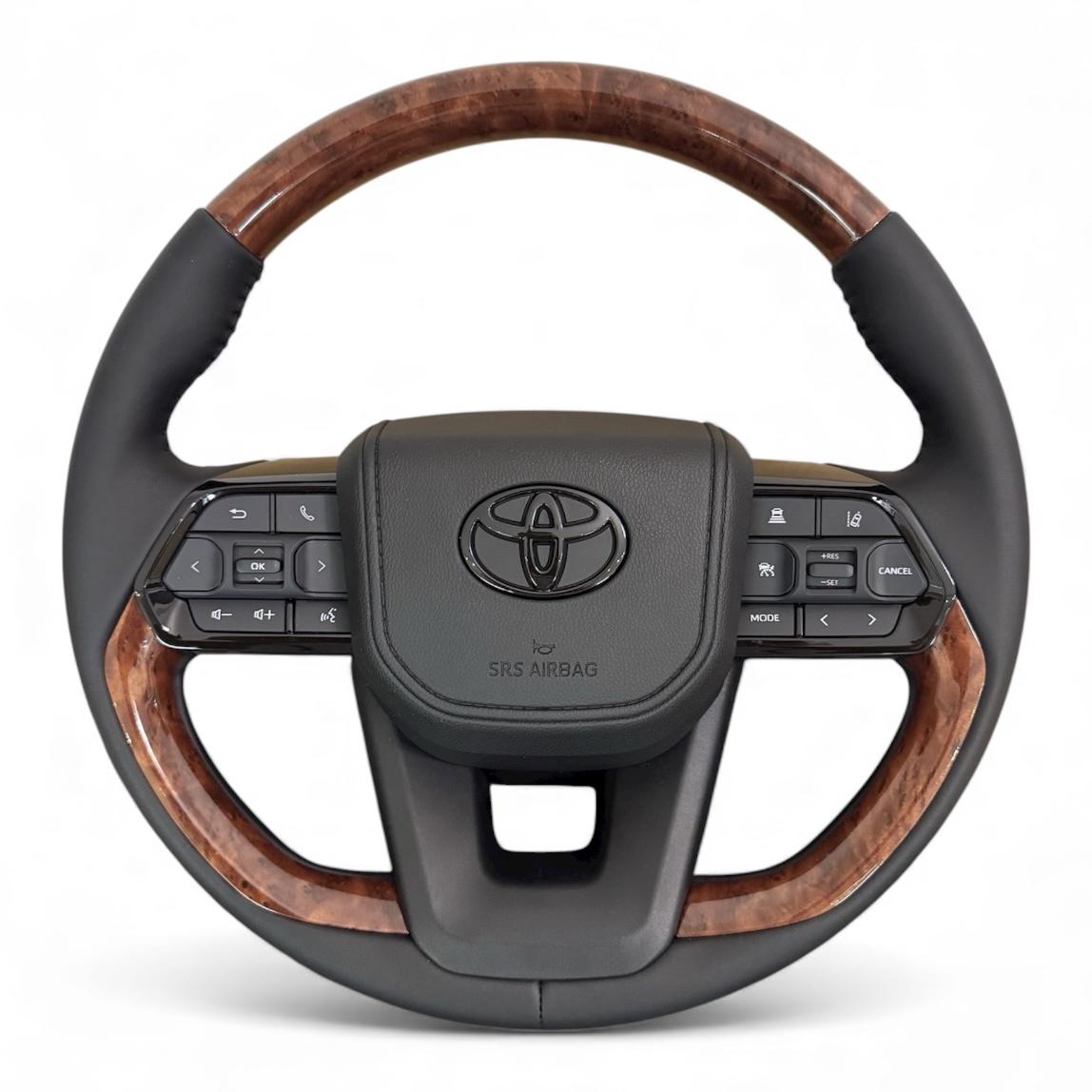 Руль для Toyota Land Cruiser 100 Prado 120 в стиле LC300 под цвет салона логотип черный глянец (28734265)