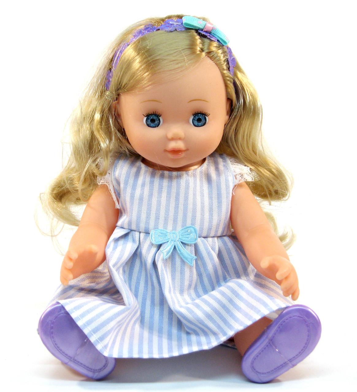 Кукла музыкальная YL 1702 F 8 фраз в сумке-рюкзаке 26 см