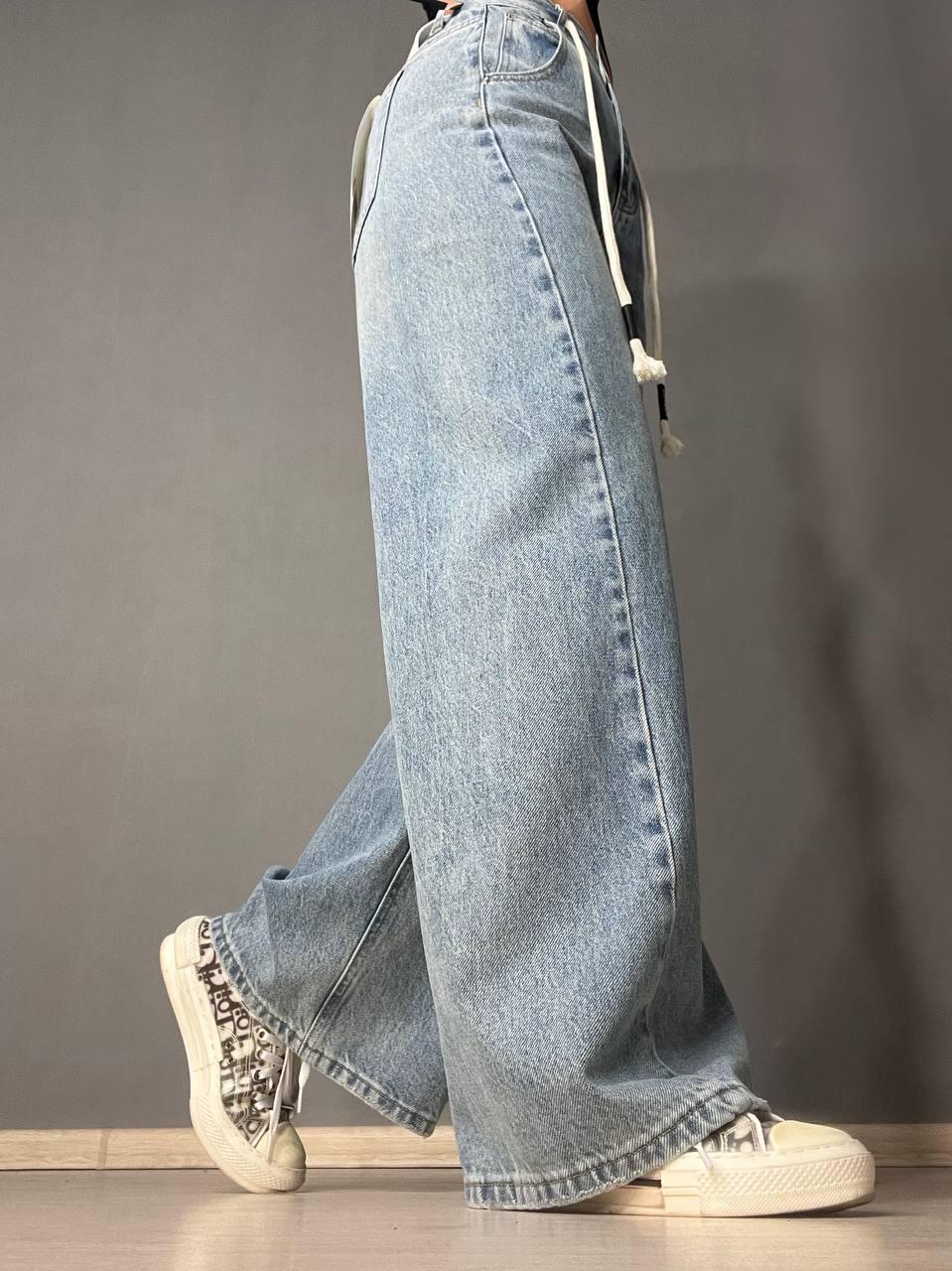 Джинси жіночі Simeile 89616 палаццо широкі зкошений шов попереду висока талія зі шнурком L Блакитний (3539) - фото 2 Джинси жіночі Simeile 89616 палаццо широкі зкошений шов попереду висока талія зі шнурком L Блакитний (3539) - фото 2