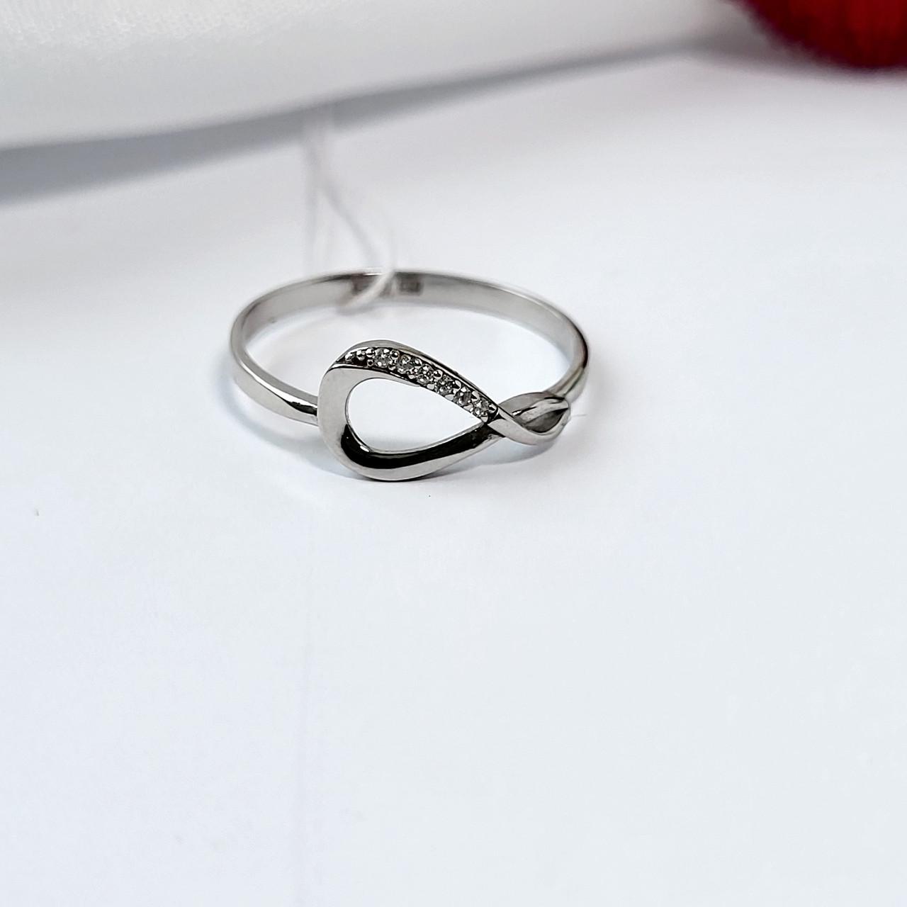 Кольцо бесконечность с белым камнем серебро 925 пробы родированное р. 18,5 (1561)