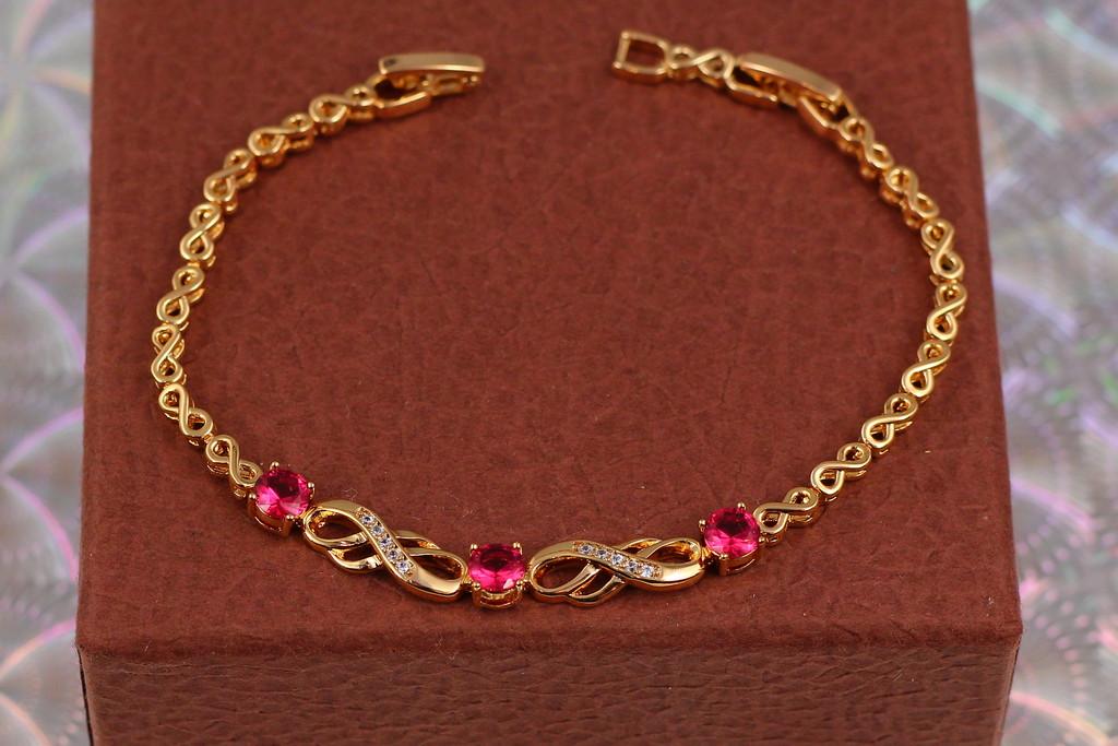 Браслет Xuping Jewelry Восьмерки с круглыми малиновыми камнями 17 см 6 мм Золотистый (1765294143)