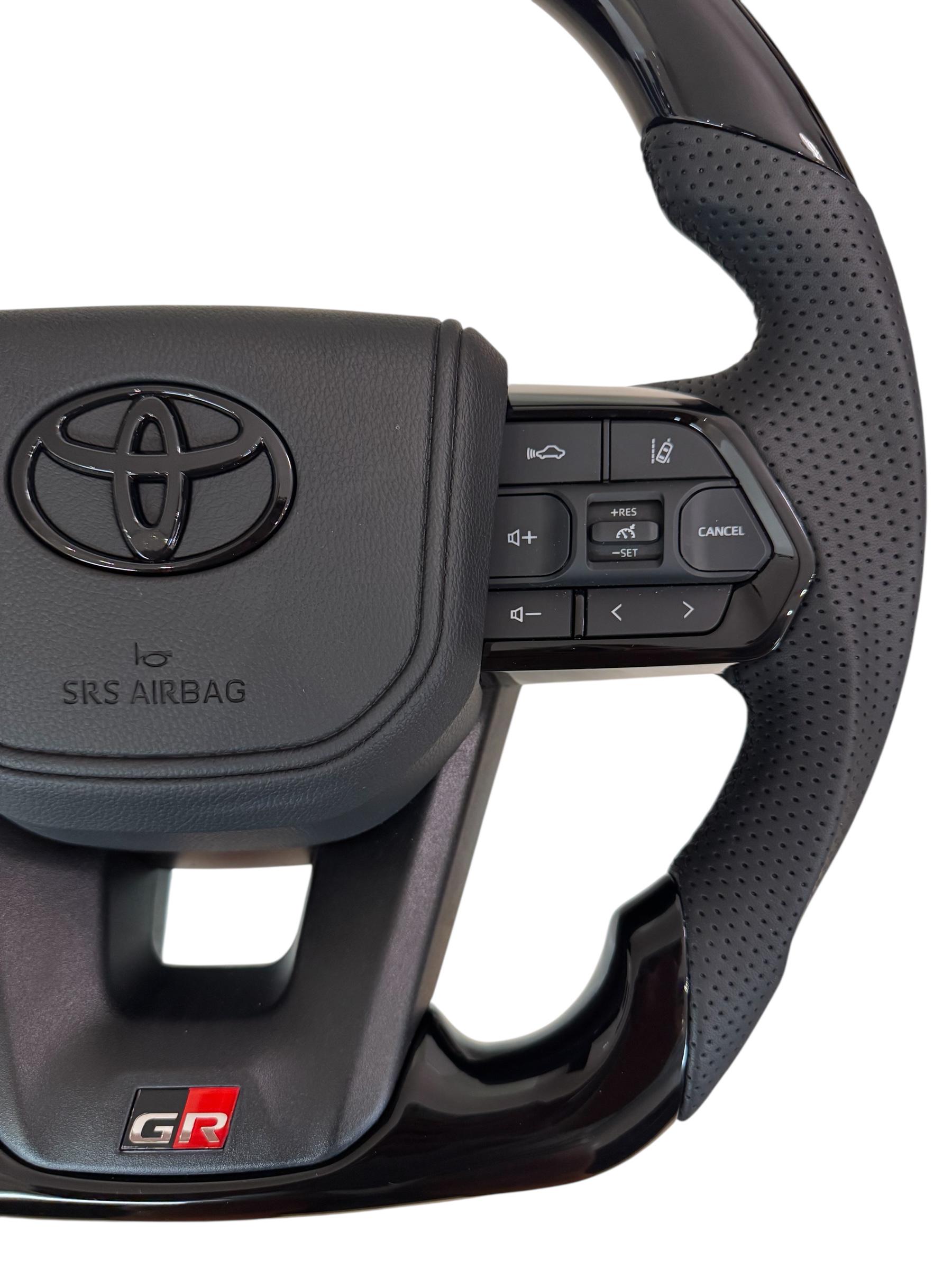 Руль для Toyota Tundra GR в сборе рояльный лак со скошенным низом логотип черный глянец (29390048) - фото 3 Руль для Toyota Tundra GR в сборе рояльный лак со скошенным низом логотип черный глянец (29390048) - фото 3