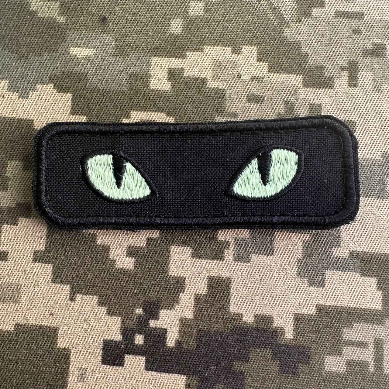 Шеврон на липучці Котячі очі що світяться в темряві 9х3 см Чорний (023) - фото 3 Шеврон на липучці Котячі очі що світяться в темряві 9х3 см Чорний (023) - фото 3