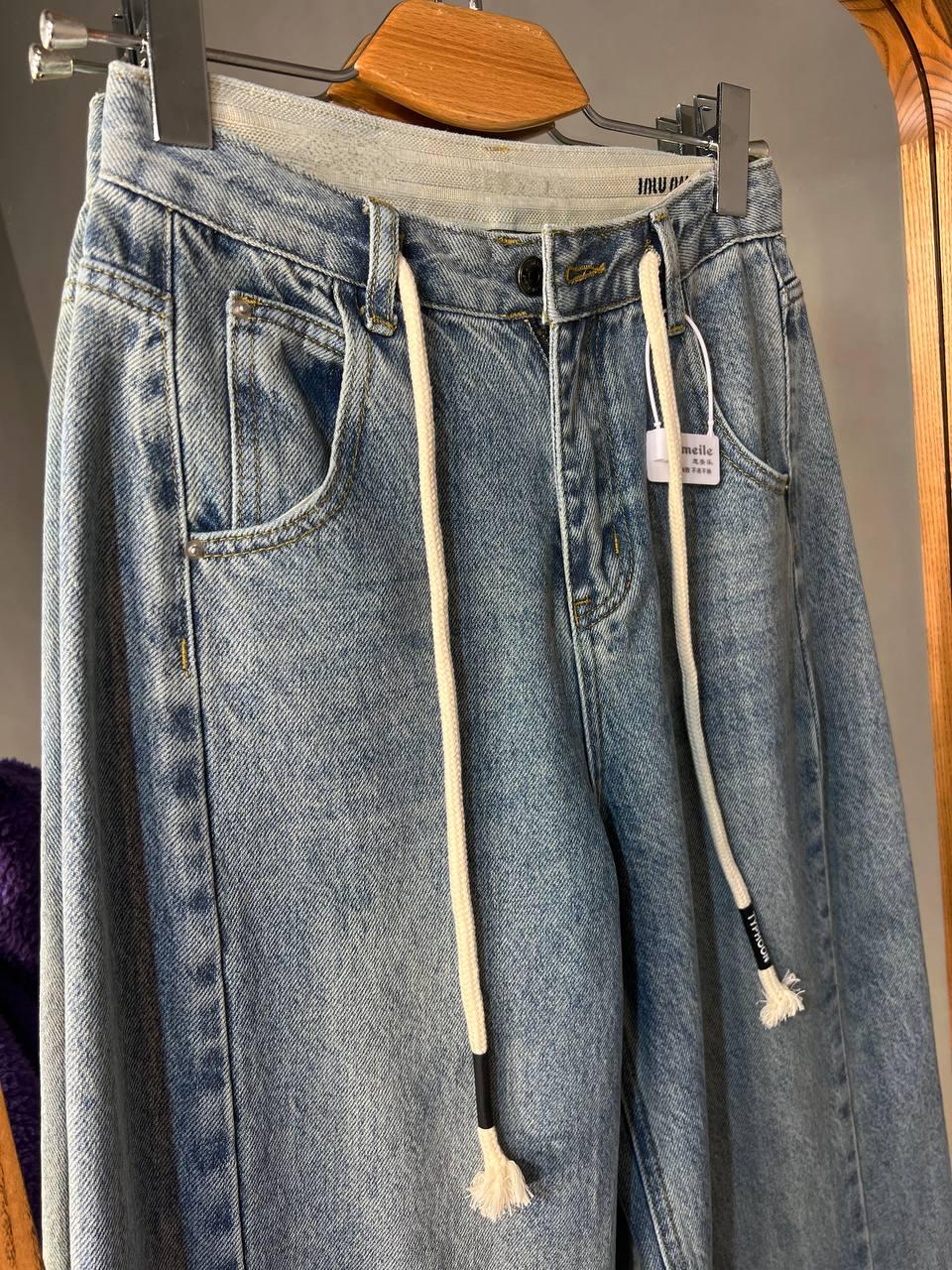 Джинси жіночі Simeile 89616 палаццо широкі зкошений шов попереду висока талія зі шнурком L Блакитний (3539) - фото 10 Джинси жіночі Simeile 89616 палаццо широкі зкошений шов попереду висока талія зі шнурком L Блакитний (3539) - фото 10