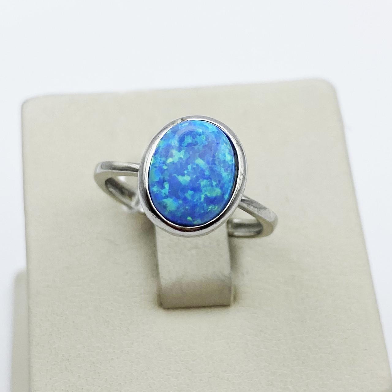 Кольцо серебряное с голубым опалом р. 17 2,31 г (1921917829)