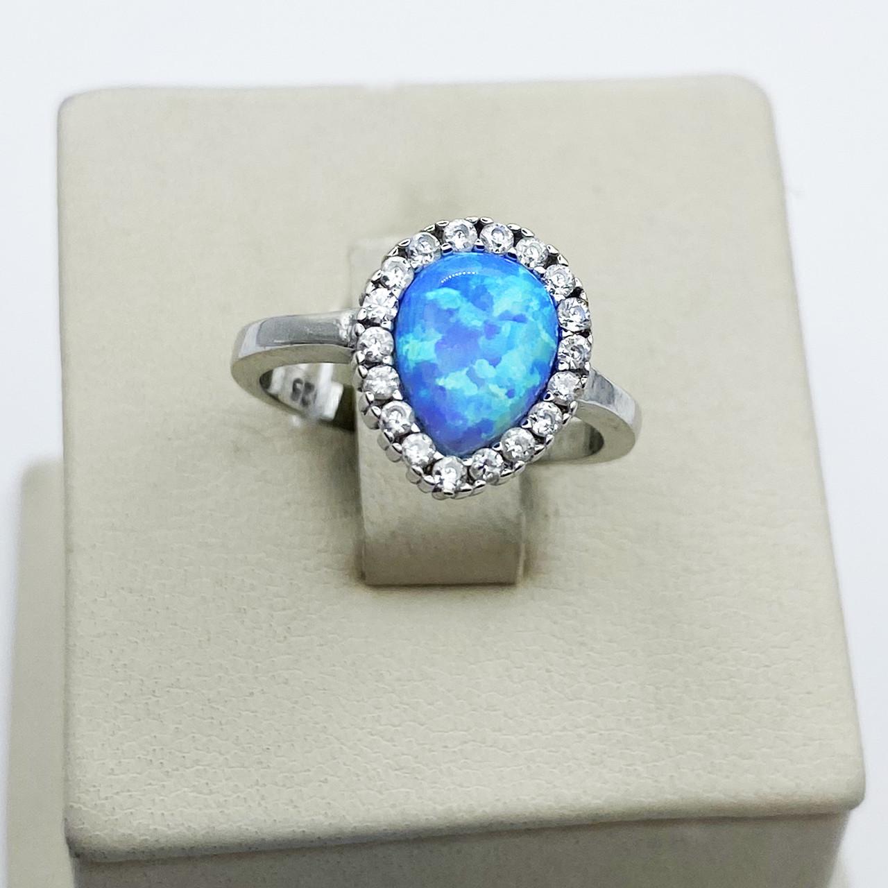 Кольцо серебряное с голубым опалом р. 17 2,66 г (1913397727)