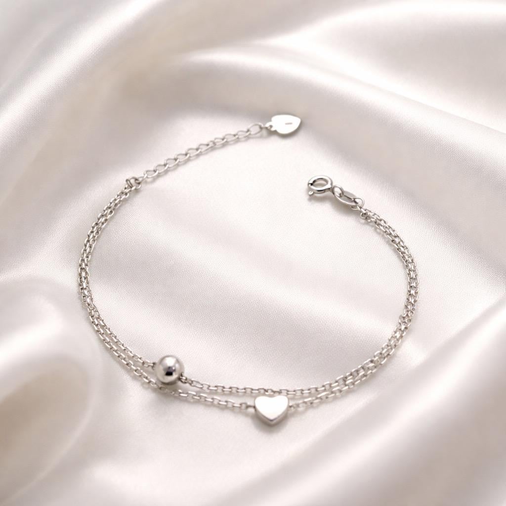 Браслет серебрянный двойной с подвеской в форме сердца и декоративным шариком р. 17-20 см