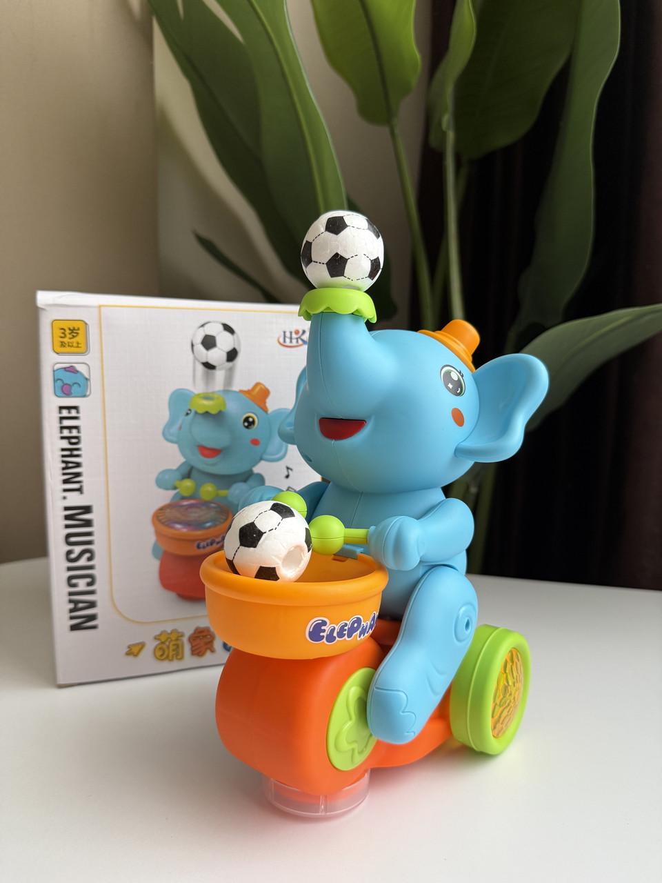 Игрушка для малышей Слоненок на мотоцикле с мячом Голубой (51) Игрушка для малышей Слоненок на мотоцикле с мячом Голубой (51)