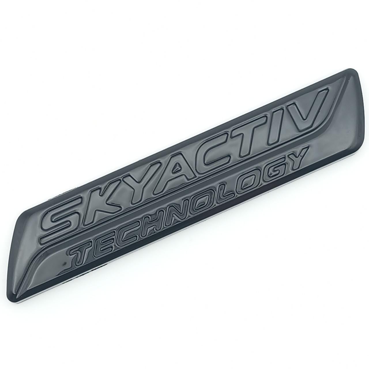 Эмблема Skyactiv Mazda ABS 10,2х2 см Черный глянцевый (2343603985)