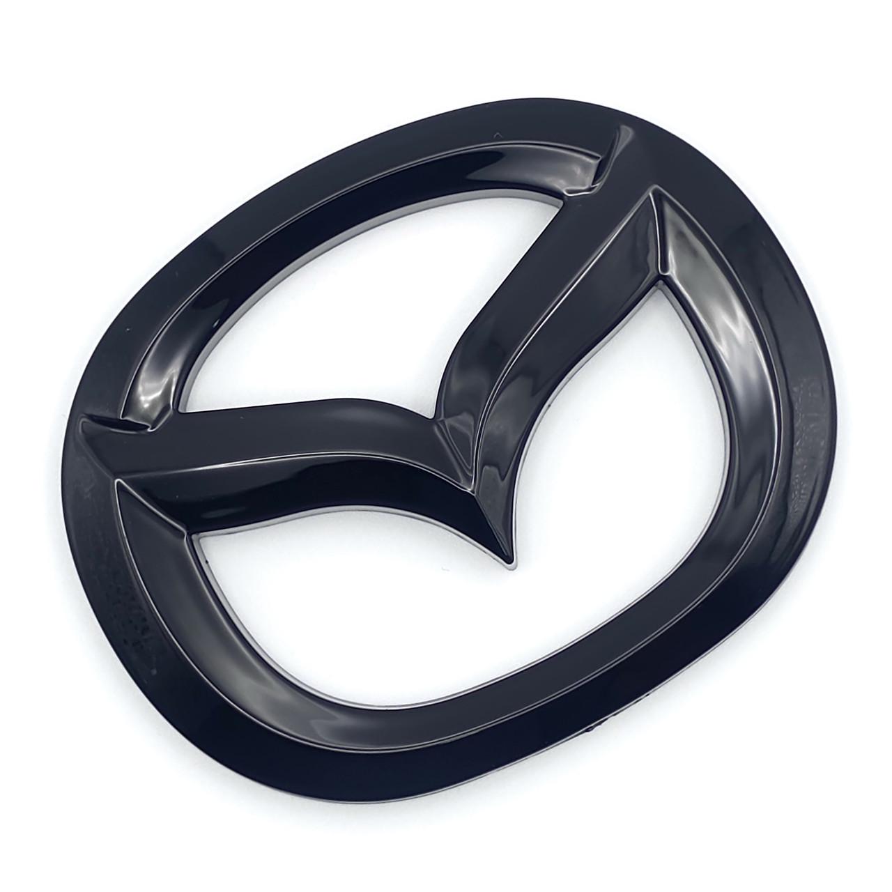 Накладка на эмблему руля Mazda 70х57 мм ABS Черный глянец (3078523602)