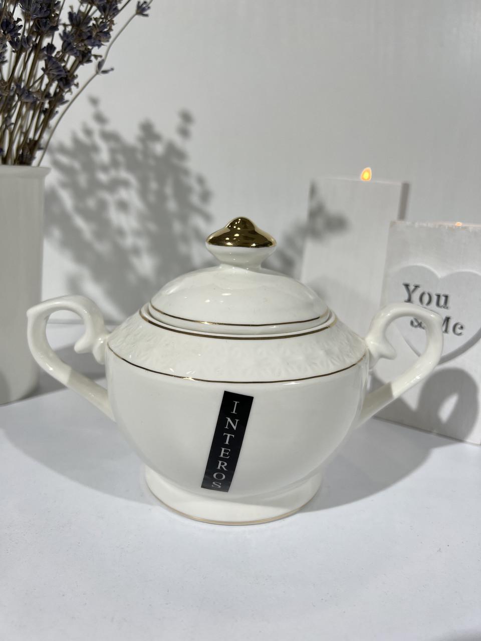 Сахарница фарфоровая Interos Снежная Королева с крышкой 500 мл Белый (933511-А) Сахарница фарфоровая Interos Снежная Королева с крышкой 500 мл Белый (933511-А)