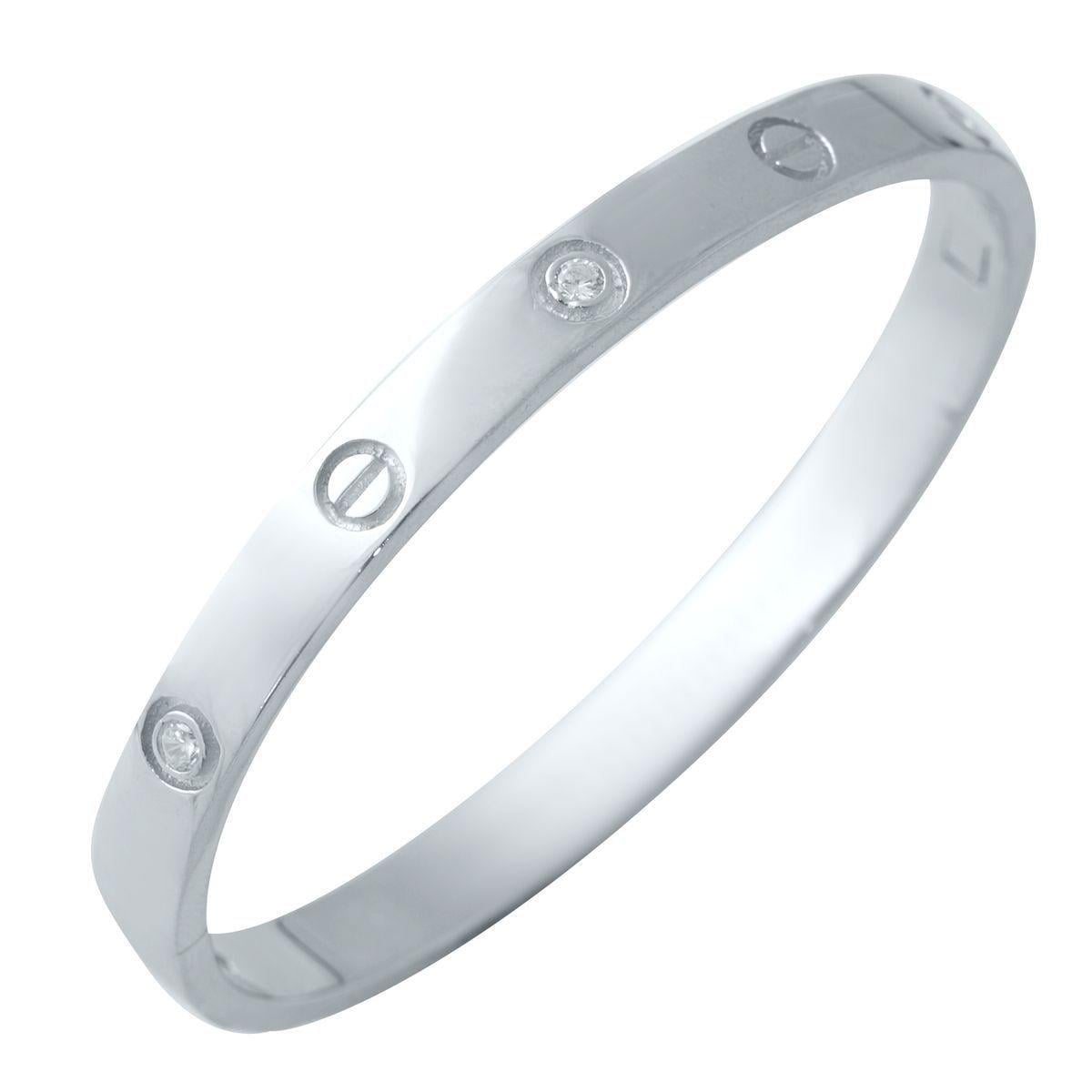 Браслет серебряный жесткий в минималистичном дизайне с декоративными вставками.