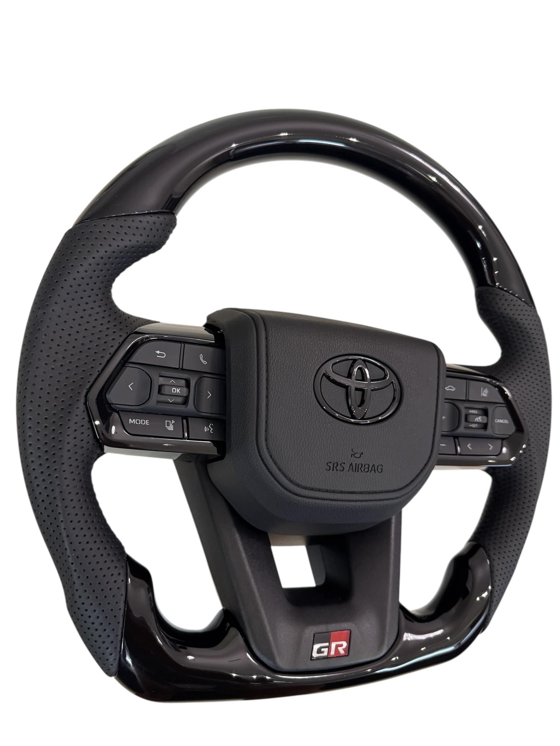 Руль для Toyota Tundra GR в сборе рояльный лак со скошенным низом логотип черный глянец (29390048) - фото 5 Руль для Toyota Tundra GR в сборе рояльный лак со скошенным низом логотип черный глянец (29390048) - фото 5