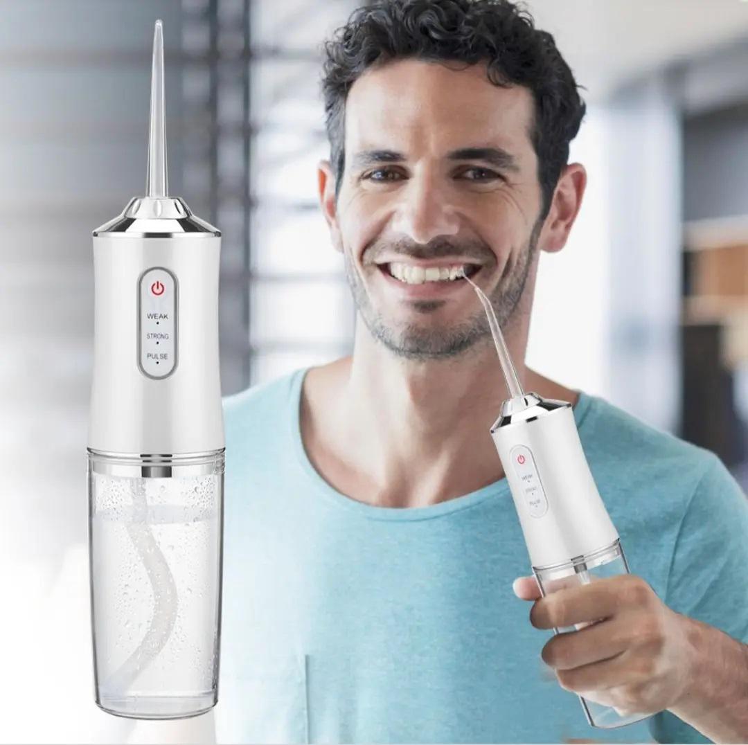 Ирригатор для полости рта портативный Portable Oral Irrigator с 4 насадками Белый - фото 2