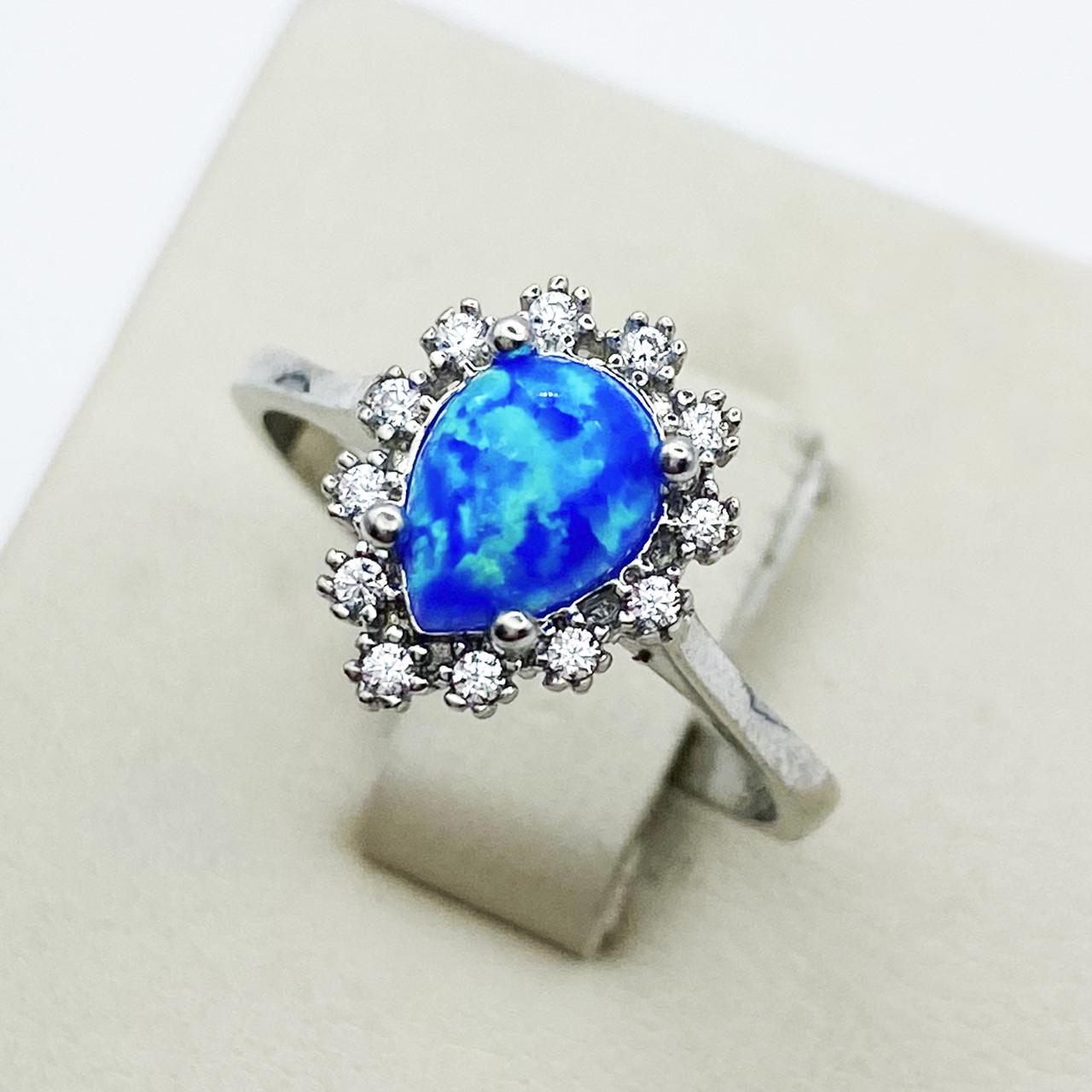Кольцо серебряное с синим опалом р. 18 2,31 г (1898329395)