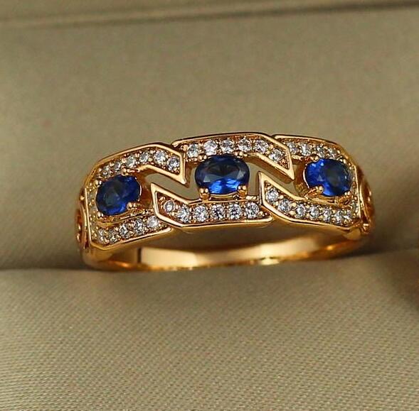 Кольцо Xuping Jewelry Волнорез с синими камнями р. 16 Золотистый