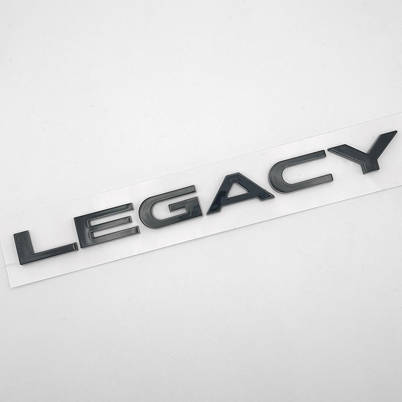 Эмблема надпись Legacy Subaru ABS 18х2,1 см Черный глянцевый (2847706164)