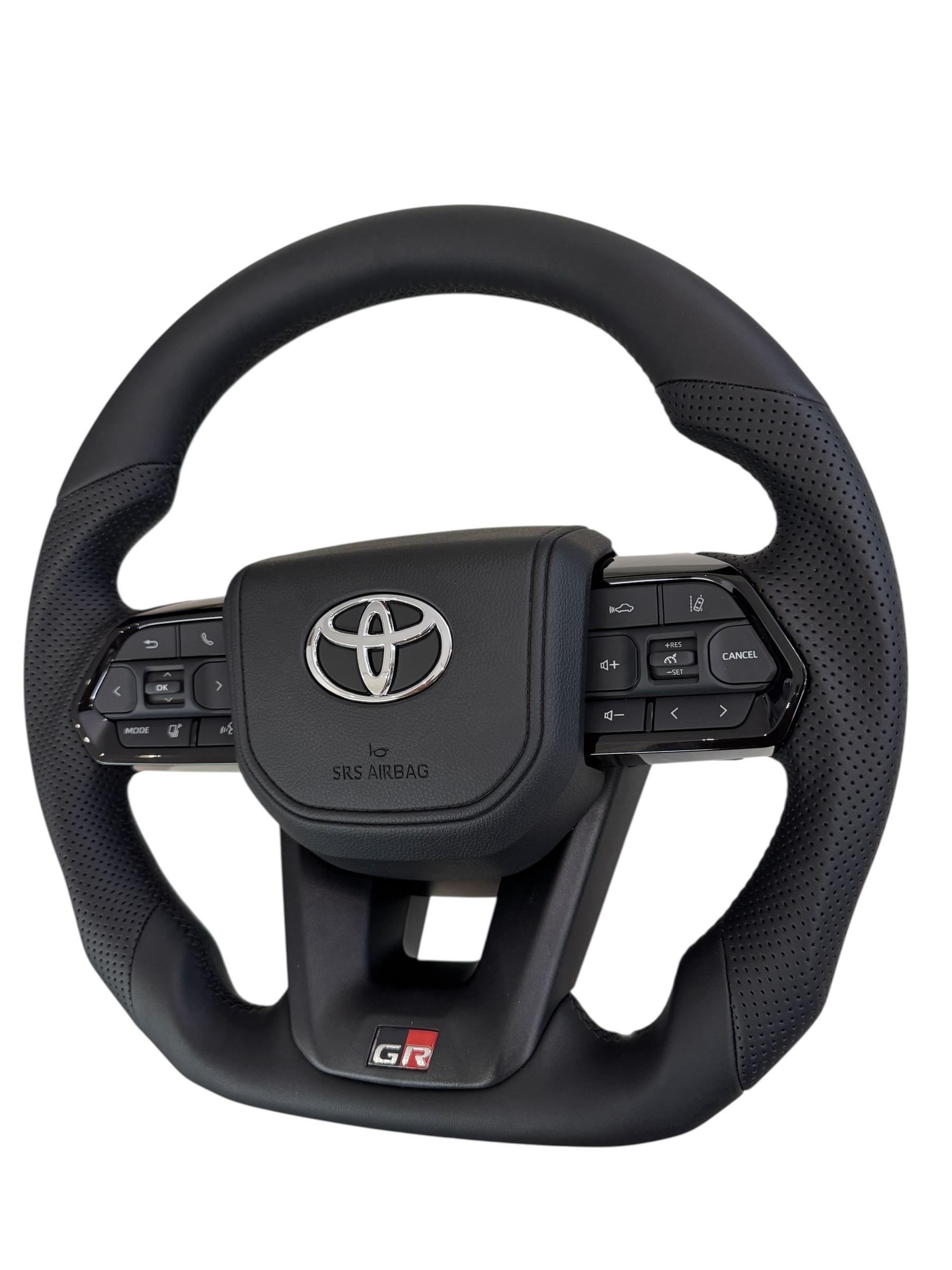 Руль для Toyota Land Cruiser 100 Prado 120 GR кожа со скошенным низом логотип хром (29342665) - фото 5 Руль для Toyota Land Cruiser 100 Prado 120 GR кожа со скошенным низом логотип хром (29342665) - фото 5