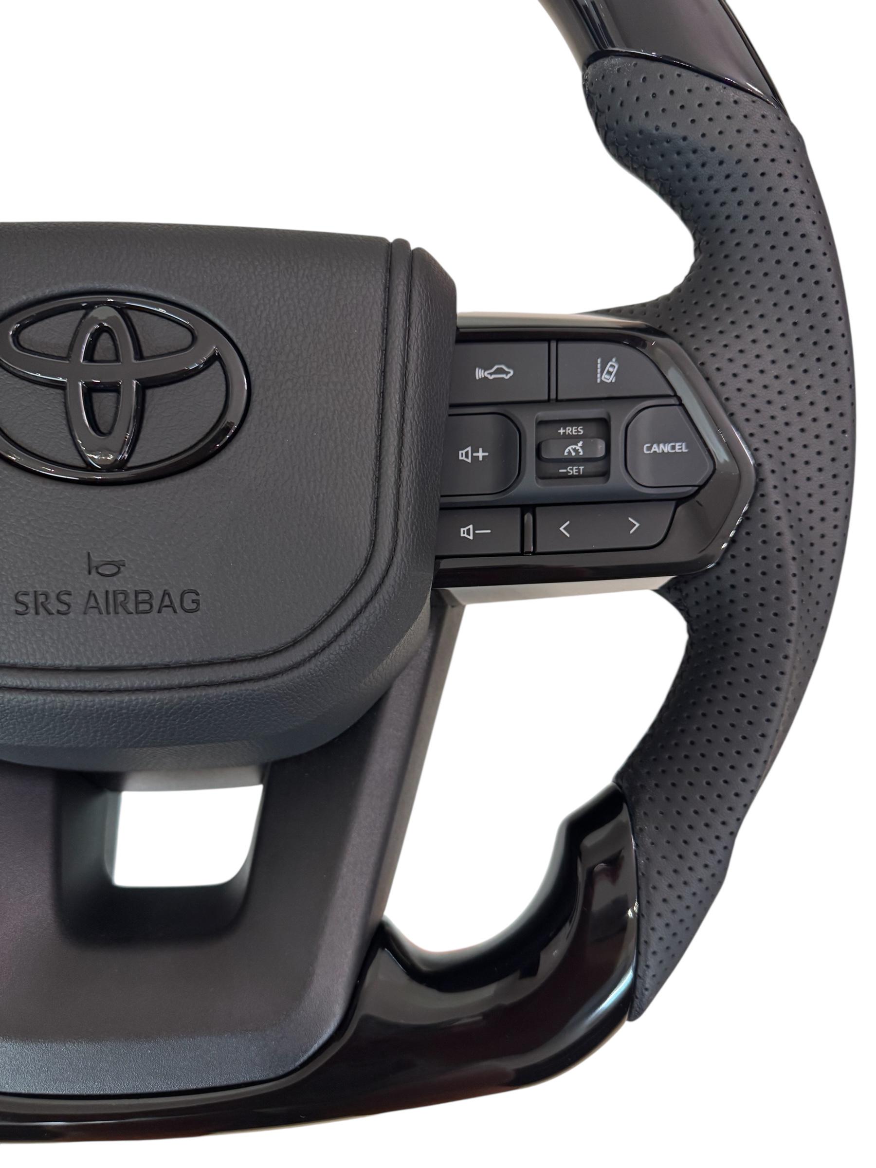 Кермо для Toyota Tundra в сборі рояльний лак зі скошеним низом логотип чорний глянець (29367413) - фото 3 Кермо для Toyota Tundra в сборі рояльний лак зі скошеним низом логотип чорний глянець (29367413) - фото 3