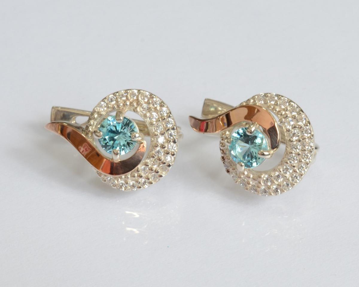 Сережки срібні зі вставками із золота 064с Камінь Світло-блакитний (21138042)