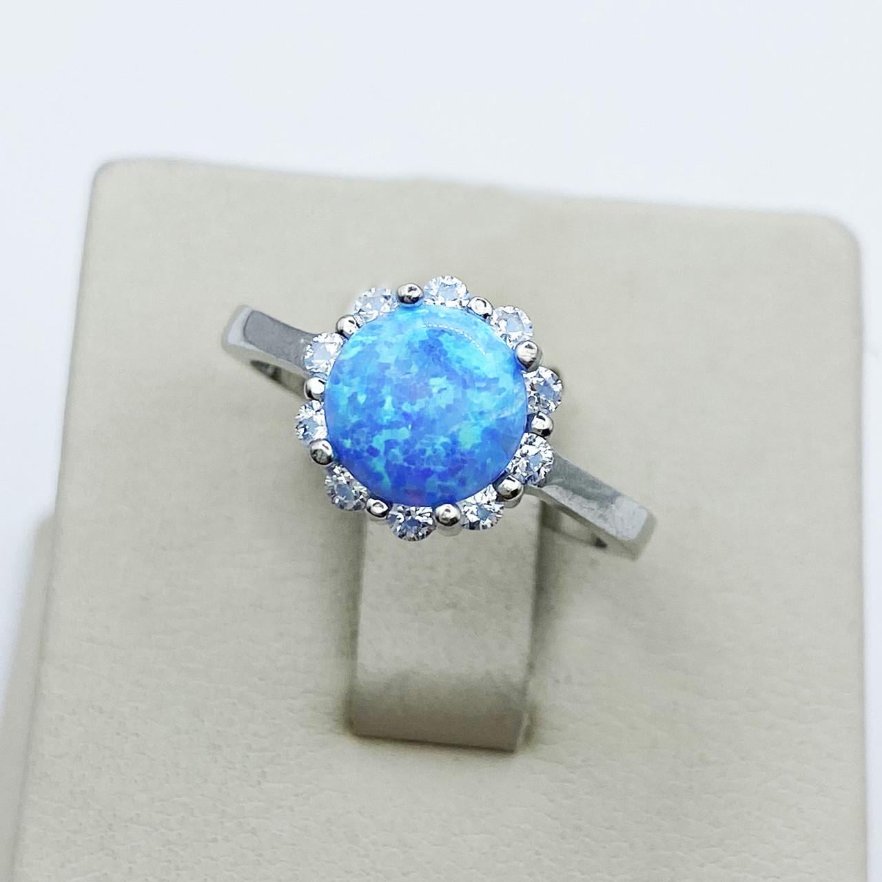 Кольцо серебряное с голубым опалом р. 18 3,19 г (1913183303)