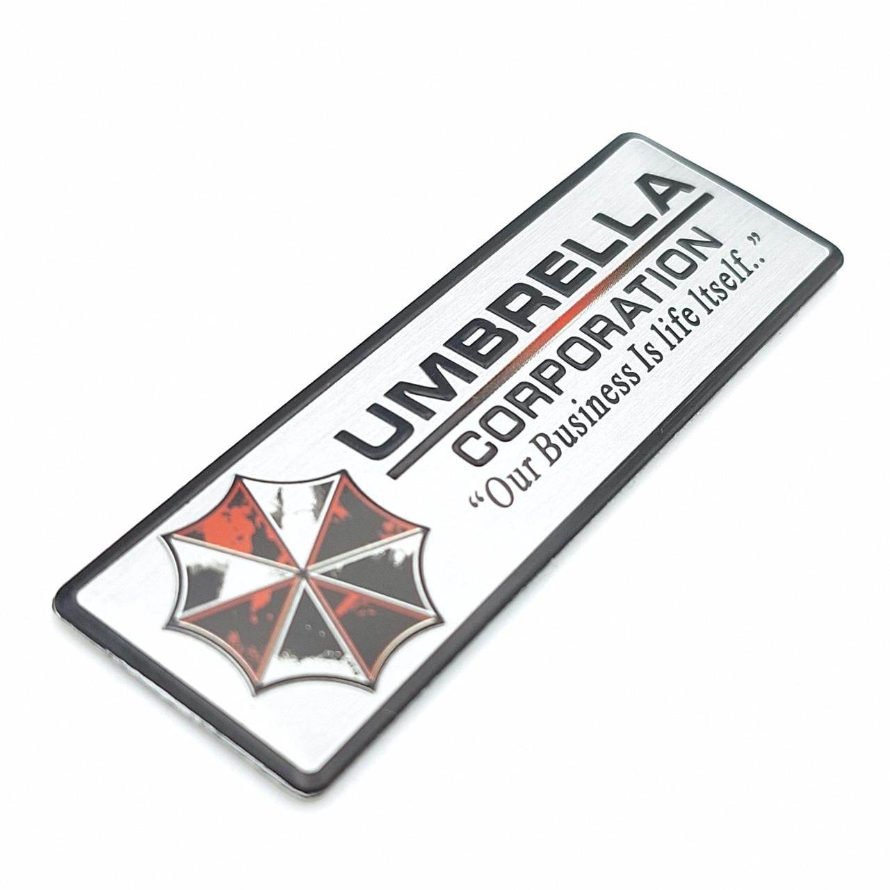Эмблема алюминиевая Umbrella Corporation 7х2,2 см Белый (1960783931)