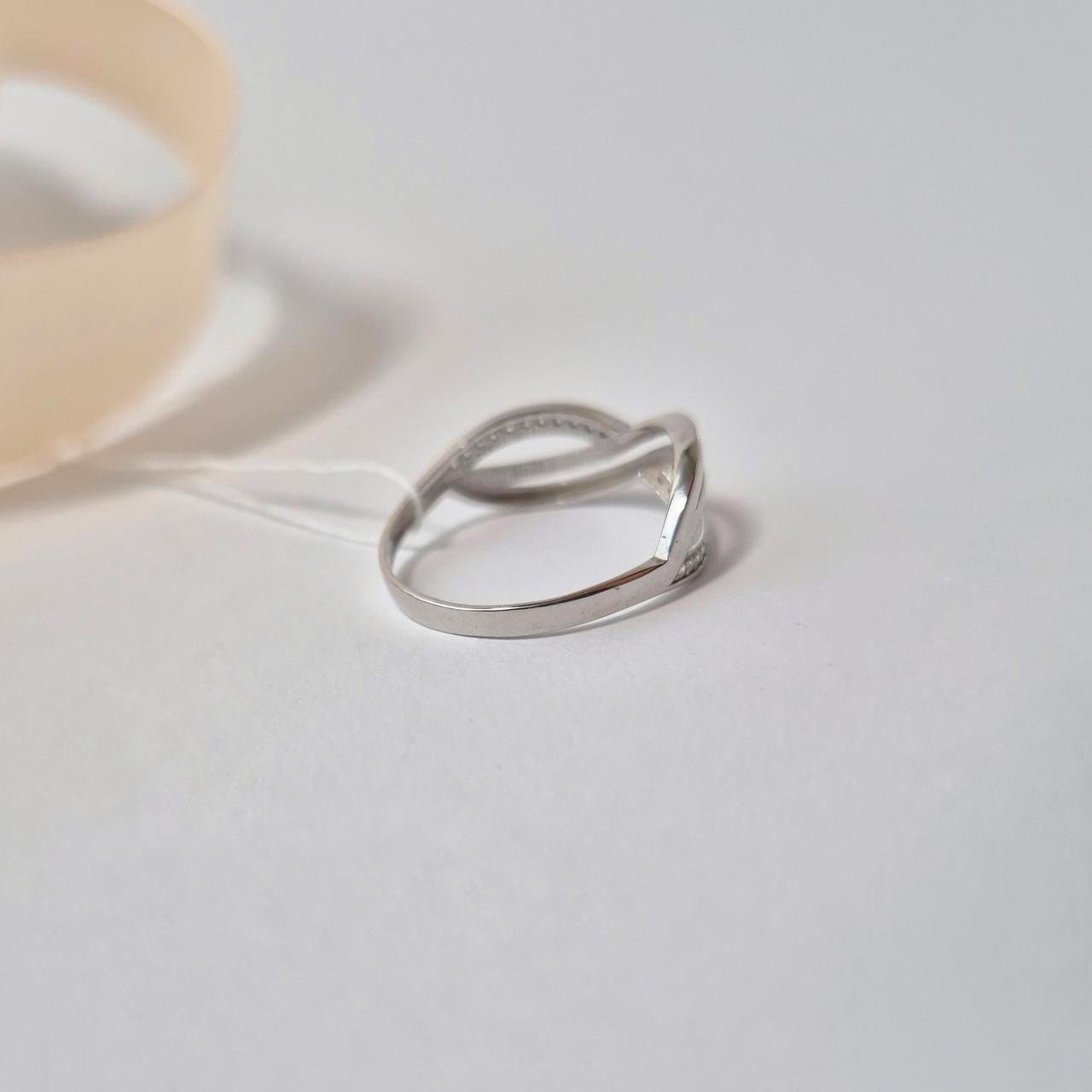 Каблучка з білими каменями нескінченність срібло 925 проби родоване р. 19.0 - фото 5 Каблучка з білими каменями нескінченність срібло 925 проби родоване р. 19.0 - фото 5