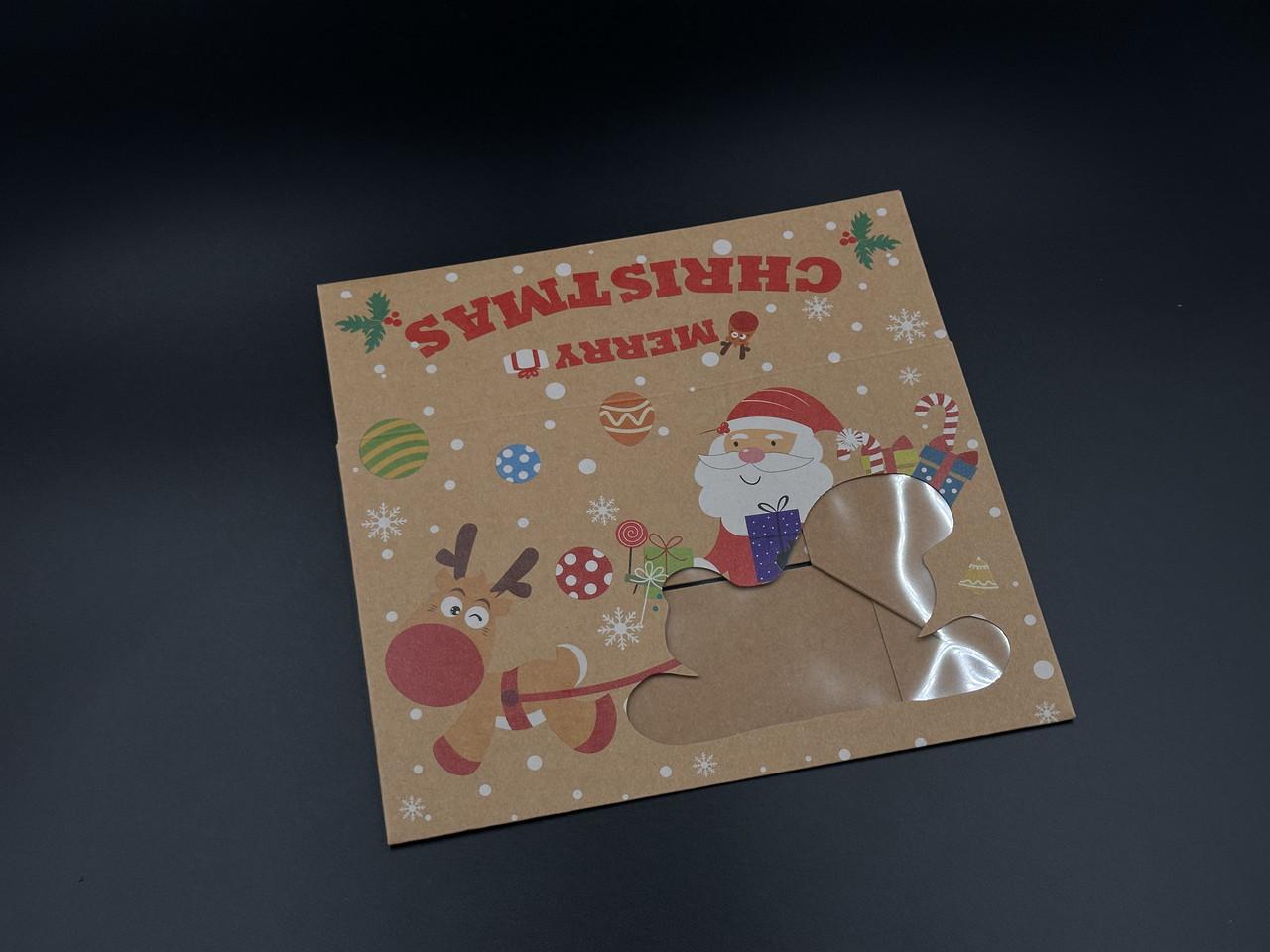 Коробка подарочная со смотровым окошком Сани Санта Клауса с принтом сборная картонная 22х14,5х7 см Крафт (OA-68) - фото 2 Коробка подарочная со смотровым окошком Сани Санта Клауса с принтом сборная картонная 22х14,5х7 см Крафт (OA-68) - фото 2