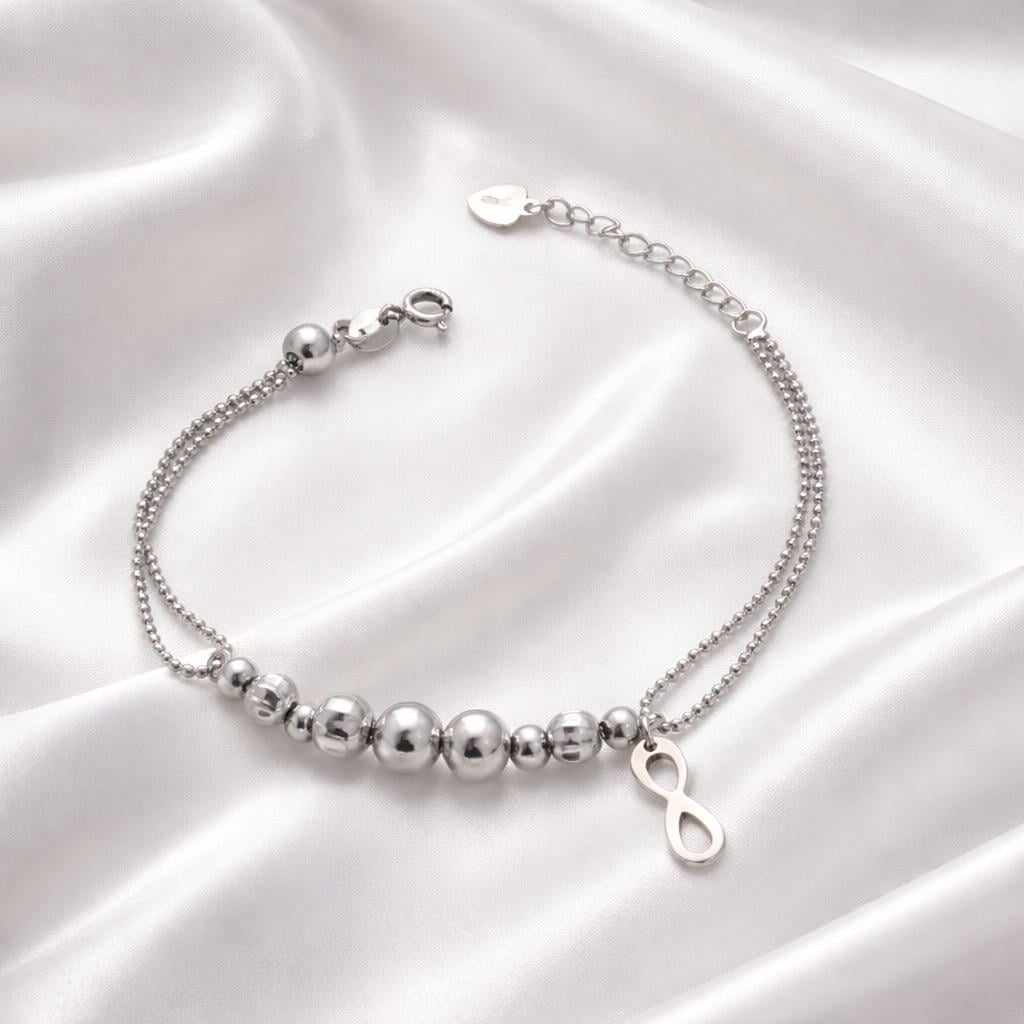Браслет срібний подвійний з декоративними кульками та підвісом Нескінченність р. 17-20 см