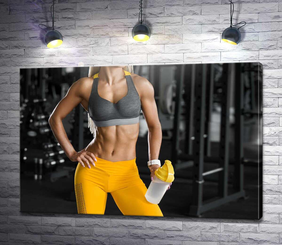 Картина ArtPoster Спортивна фігура дівчини на фоні спортклубу 130x87 см Модуль №1 (004571)