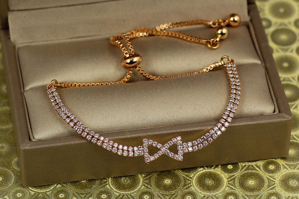 Браслет регулируемый Xuping Jewelry две дорожки с бантиком на бегунке Золотистый (2114743462)