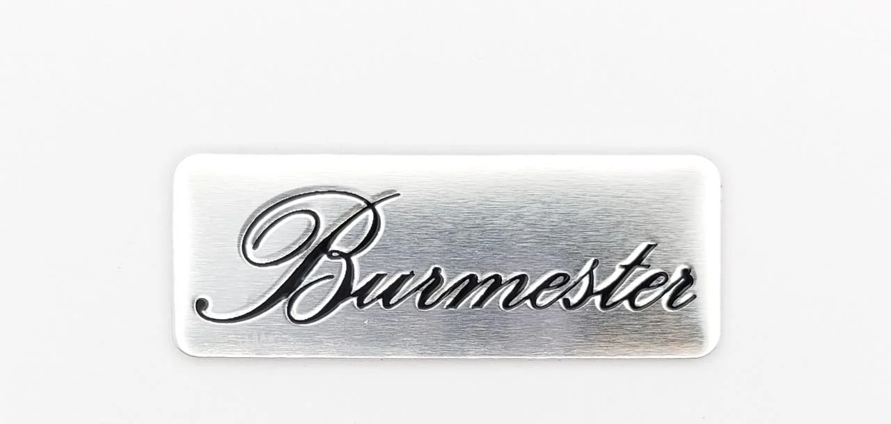 Эмблема Burmester на сетку динамика 4х1,5 см (1693765454)