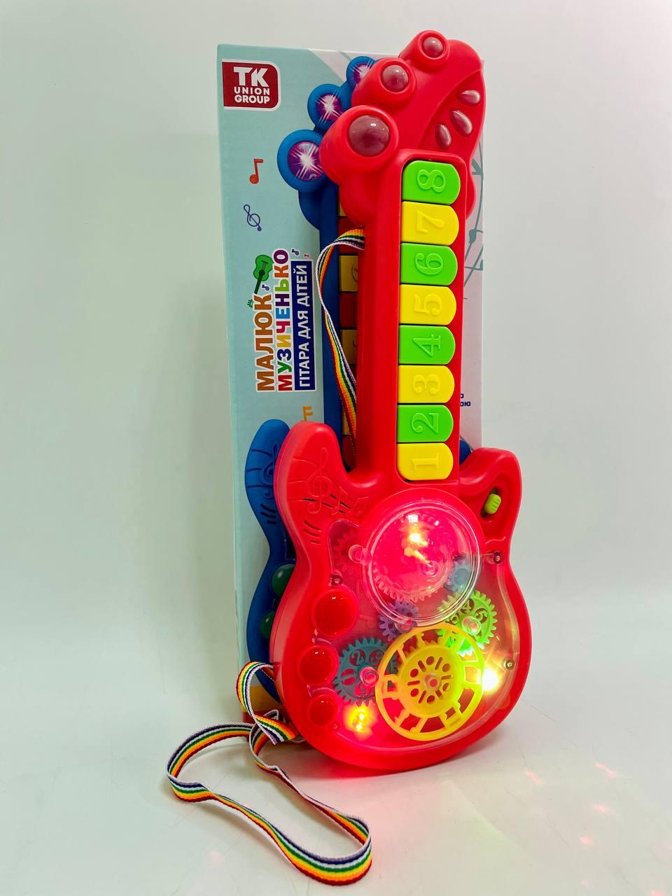 Гитара на батарейках TK Group 2 режима игры/8 песен/пианино/прозрачный корпус/подвижные шестерни Красный - фото 3 Гитара на батарейках TK Group 2 режима игры/8 песен/пианино/прозрачный корпус/подвижные шестерни Красный - фото 3